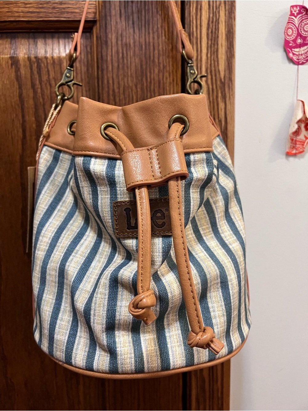 Lee Striped Canvas Drawstring Bucket Bag in Tan and Blue
